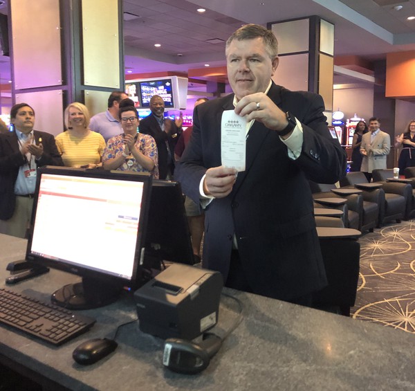 Oaklawn manager Wayne Smith places the first bet