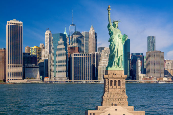 Statue of liberty and New York City Skyline with Financial District of Manhattan Lower East Side, World Trade Center, FDR Drive, Beekman tower and East River, NY, USA.